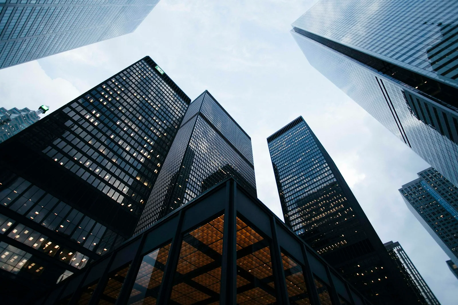 Glass financial district towers rising into a clear sky